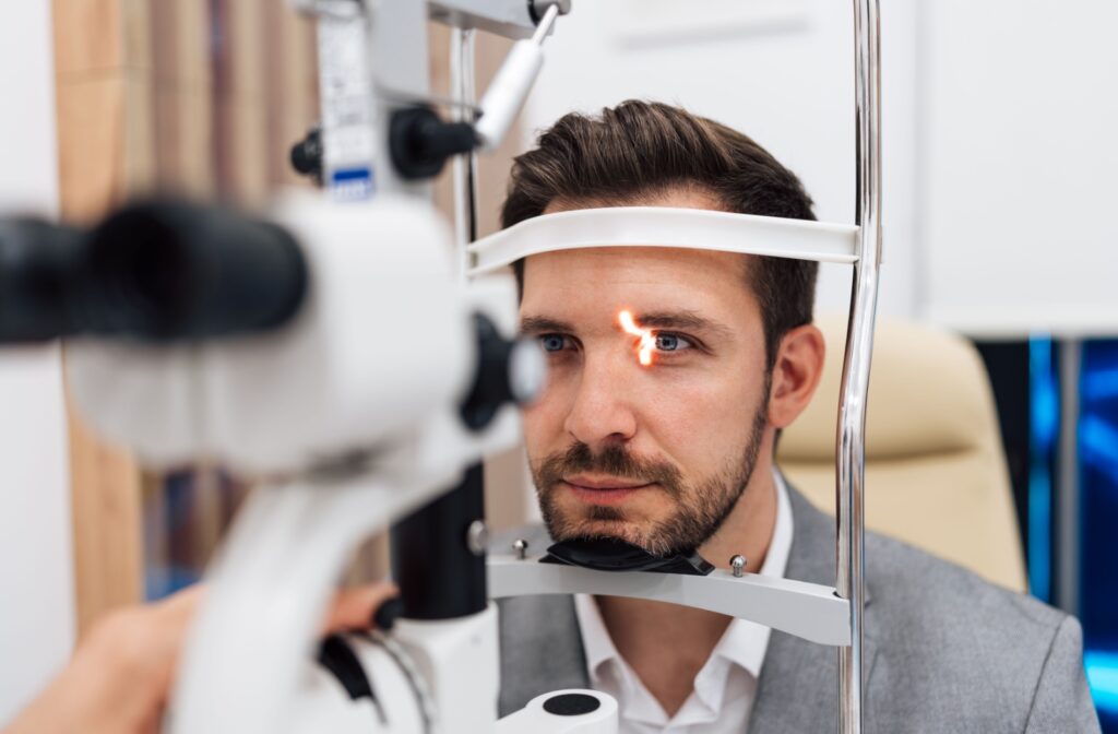 A patient's corneal health is assessed with a slit lamp exam during their emergency eye visit.
