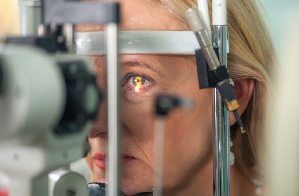 A person having their eyes examined by an optometrist for signs of macular degeneration.
